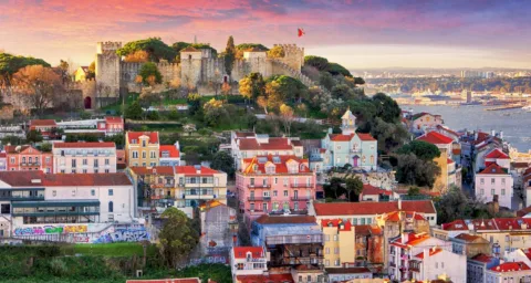 A panoramic view of Lisbon's colorful cityscape with the iconic São Jorge Castle at its heart.