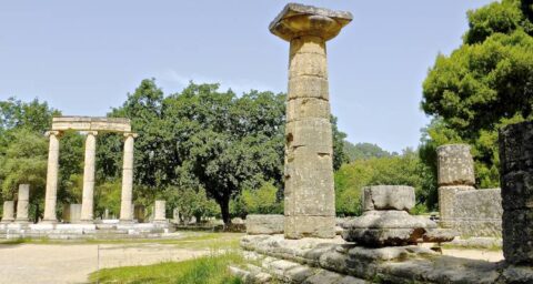 A collage showcasing nine iconic landmarks of Classical Greece, including the Acropolis, Delphi, Mykonos beaches, and ancient ruins bathed in warm sunlight. Perfect for history and culture enthusiasts. Book your Grand Voyages Greece tour package today!